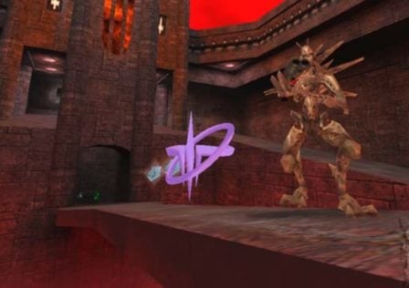 Feature image for our news article on Quake source port tutorials. It shows a screenshot of a remastered version of Quake, where an enemy with a gun is standing on a walkway.