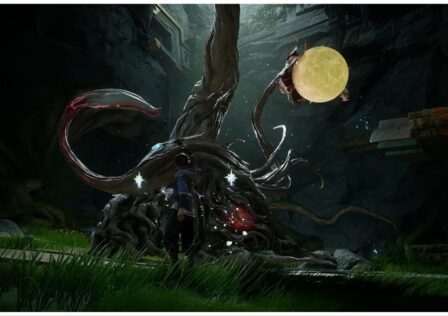 feature image for our honor of kings world ray tracing trailer news, the image is a screenshot from the combat trailer for the game of a character battling against a large monster that resembles a plant underground as they are surrounded by stone and grass