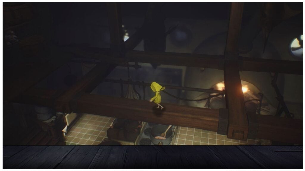 feature image for our little nightmares mobile release news, the image features a screenshot from the game of six trying to balance on wooden beams attached to the ceiling as she walks above a large kitchen with a pot of food boiling on the stove with a spoon inside the pot, there is also a furnace that is roaring with fire