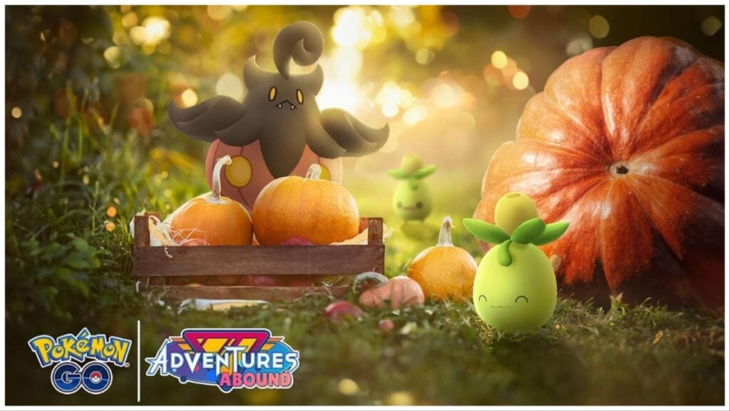 The image shows the Pokemon Pumpkaboo sitting on top of pumpkins. Smoliv is off to the right-hand side looking rather happy to be participating in the event! The scenery is a lush forest with light dripping in through a canopy behind the Pokemon.