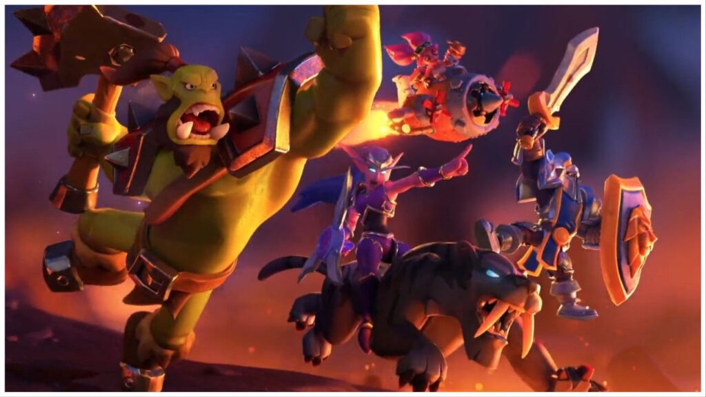 feature image for our warcraft rumble release date news, the image features a screenshot from the release date announcement video of an orc, night elf and a knight riding into battle, the orc is holding a large hammer while shouting, and the night elf is riding a saber tooth tiger as she holds her weapons and points forward, the knight is holding a sword and shield as they jump into the air, and there is a gnome sat on a sort of turret blasting through the air