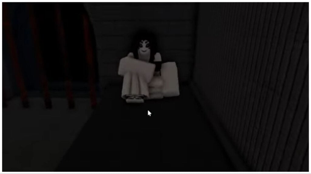 the image shows michibane aura sat against a dark wall and the floor is also very dark so its hard to see what is truly happening. Michibane is wearing all white and has an unsettling uncanny valley type face