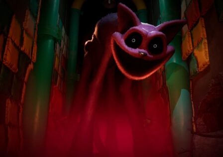 Feature image for our Poppy Playtime Forever characters guide. It shows the character Captnap, a large toy cat with dark eyes, looking in a red lit corridor.
