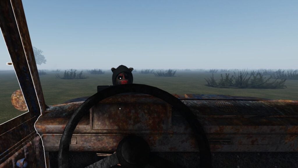 Feature image for our Long Drive guide on Svintusov. It shows a view from the driving seat of the game's car, with a Svintus in front of the car, facing the player. It resembled a person in a black hoodie with a black and red pig mask on, with one glowing eye.