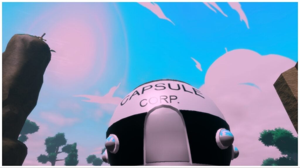 The image shows a bottom up view of the Capsule Corps building which is circular and black and white. Off to the left is a stony pillar. The sky behind the corps is blue, pink and cloudy