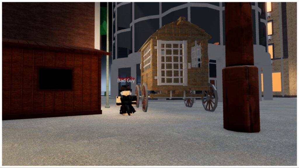 The image shows a bandit next to a wheeled shack in between two buildings at night time. There is a faint glow coming from the buildings lights either side and the bandit is wearing all black and looking to the viewer