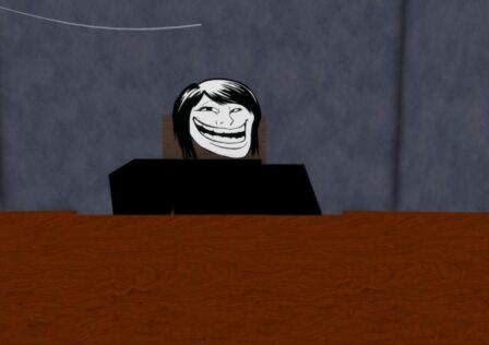Feature image for our Trollge Conventions codes guide. It shows an in-game view of the Trollina character, sat at a desk.