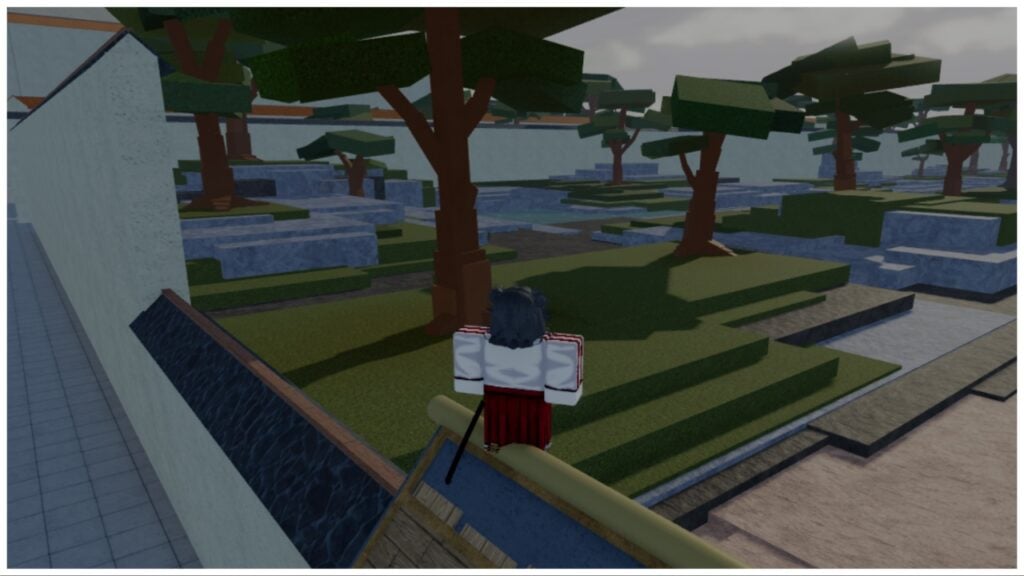The image shows the back of my avatar who wears white robes with red pants and a katana equipped to her waist. She is stood on a rooftop overlooking a garden of trees and grass below