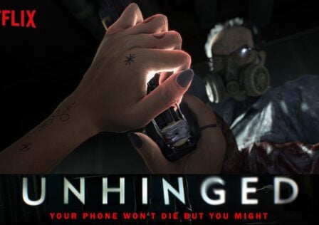 featured image for our news on Netflix Unhinged. It shows a hand holding a phone and a mysterious character standing in front.