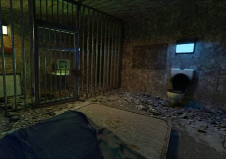 featured image for our news on Mini Escapes: The Below. It shows a prison room with a bed, a toilet and light. Outside the prison is a computer desktop on a table.